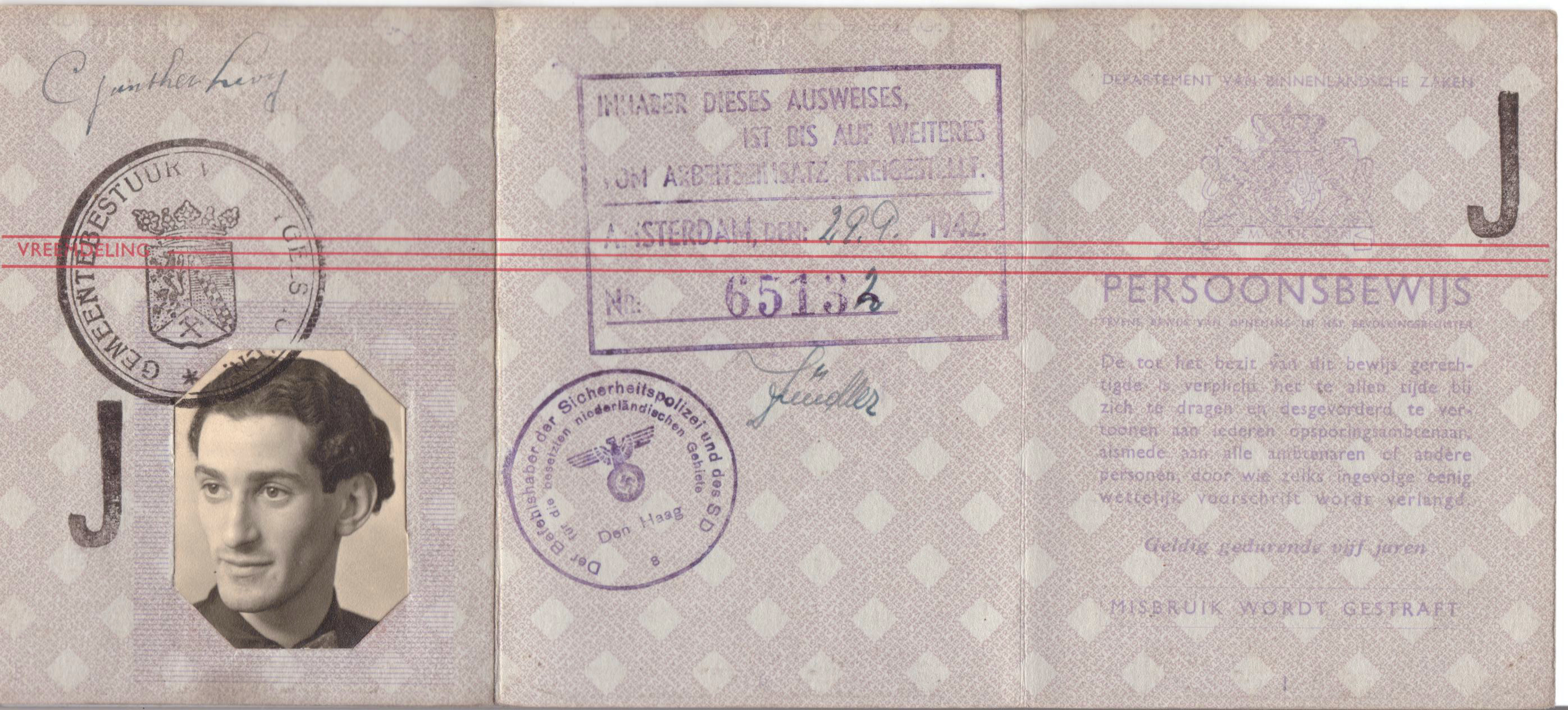 Dutch identity card of Günther Levy, with his photo and signature and two stamps 